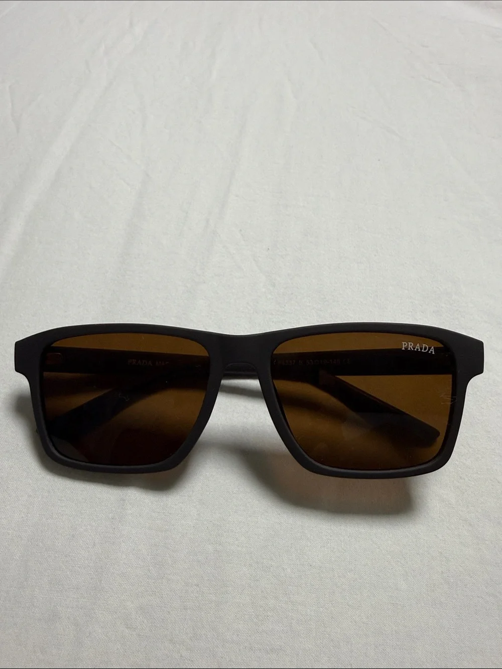 Prada Black Frame Sunglasses with Brown Lenses